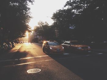 Car on road at sunset