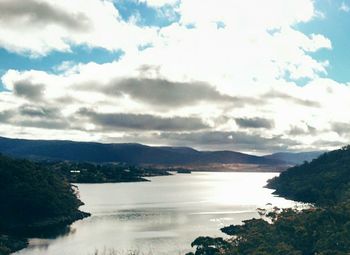 Scenic view of mountains against cloudy sky