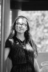 Portrait of young woman wearing eyeglasses