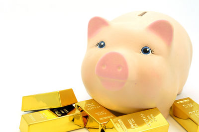Close-up of yellow toy over white background