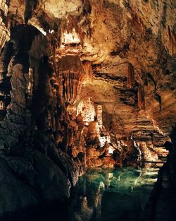 Low angle view of illuminated cave