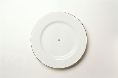 High angle view of fork over white background