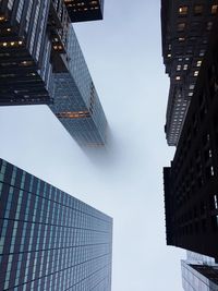 Low angle view of skyscrapers against clear sky
