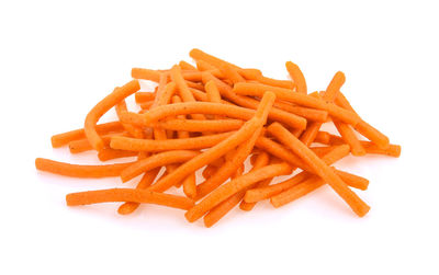 Close-up of sliced carrots on white background