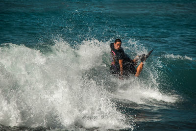 Man surfing in sea