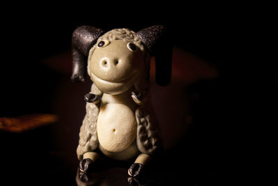 Close-up of stuffed toy against black background