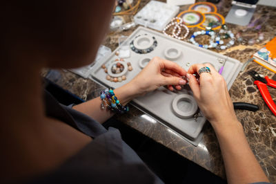Cropped hand of man working on table