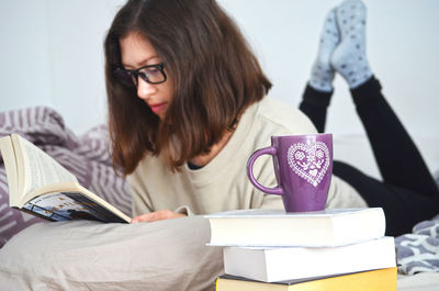 Young woman reading book