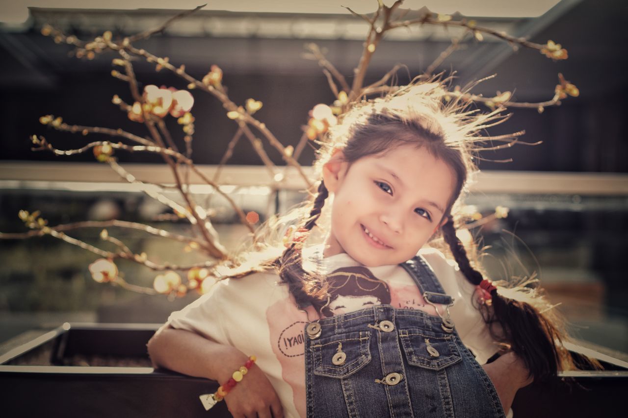 child, portrait, one person, one girl only, beauty, girls, flower, childhood, people, happiness, smiling, outdoors, close-up, flower head, human body part, day, desaturated