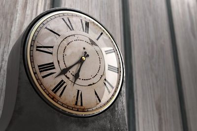 Low angle view of clock on wall