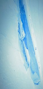 Close-up of snow on blue ice