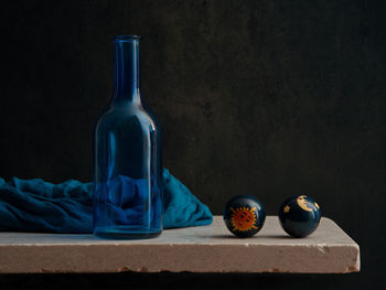 Close-up of wine bottles on table