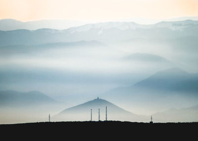 Scenic view of silhouette mountains against sky