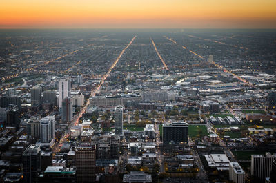 Aerial view of city at sunset