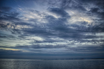 Scenic view of sea against dramatic sky