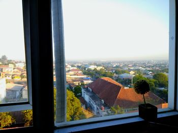 Cityscape seen through glass window