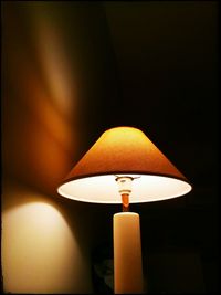 Low angle view of lit lamp