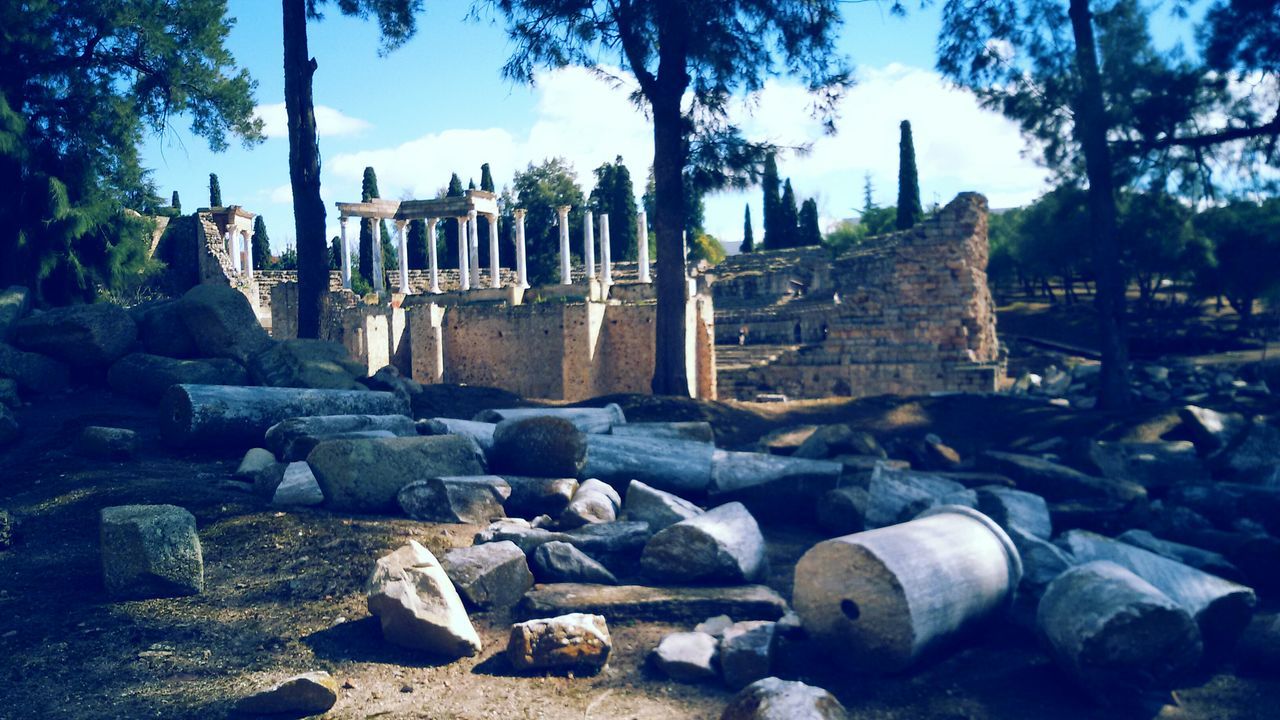 architecture, built structure, building exterior, history, old ruin, tree, the past, sky, ancient, stone material, ancient civilization, old, stone wall, famous place, stone - object, religion, travel destinations, rock - object, stone, sunlight