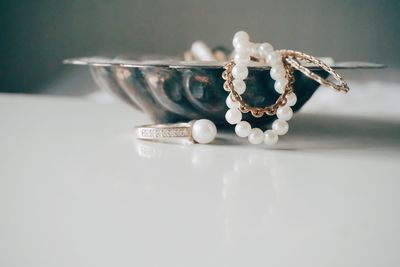 Close-up of jewelry on table