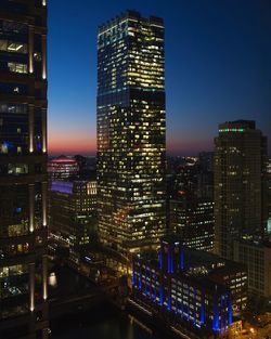 Illuminated buildings in city at night