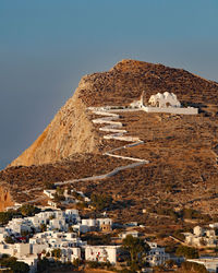 Church of panagia, virgin mary, stands on the mountainside overlooking the chora of folegandros