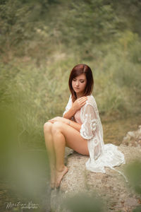 Young woman sitting outdoors