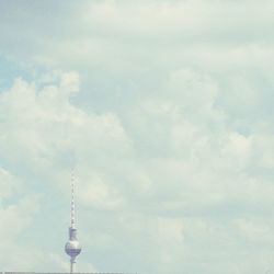 Low angle view of communications tower against sky