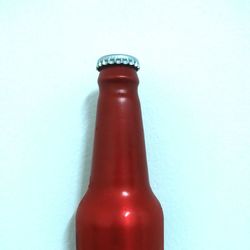 Close-up of glass bottle against white background