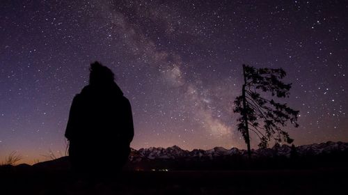 Low angle view of moon against star field