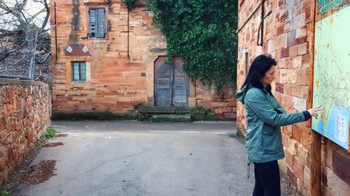 Woman in front of building