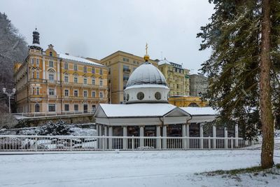 Building against sky during winter