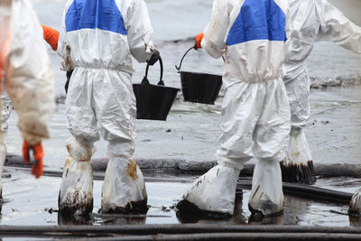 Manual workers working in dirty water