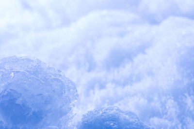 Close-up of snow against sky