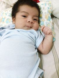 Cute baby sleeping on bed