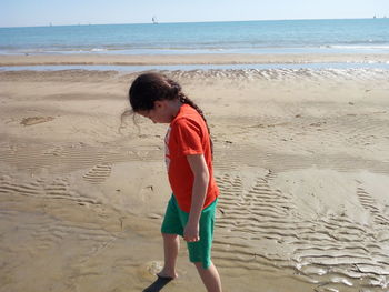 Full length of girl at beach