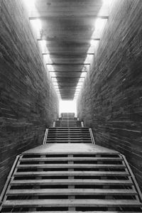 Staircase in illuminated corridor