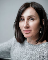Close-up portrait of beautiful woman at home