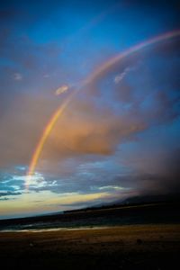 Rainbow over sea against sky