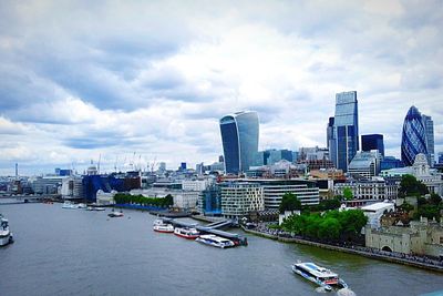 Cityscape against cloudy sky