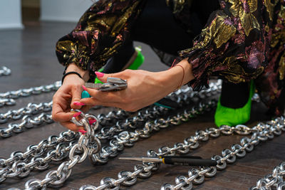 Midsection of woman holding umbrella