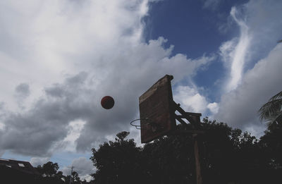 Low angle view of building against cloudy sky