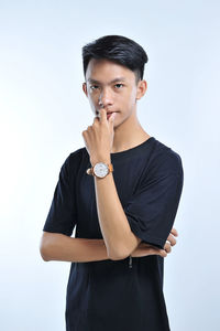 Portrait of a handsome young asian man doing casual pose