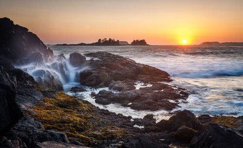 Scenic view of sea against clear sky during sunset