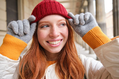 Portrait of young woman wearing knit hat