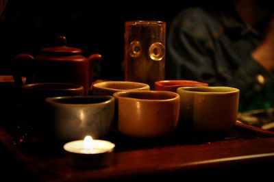 Close-up of tea light candles on table