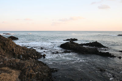 Scenic view of sea against sky during sunset