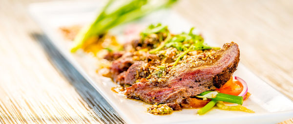 Close-up of meat on barbecue grill