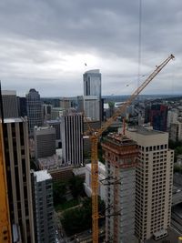 Cityscape against cloudy sky