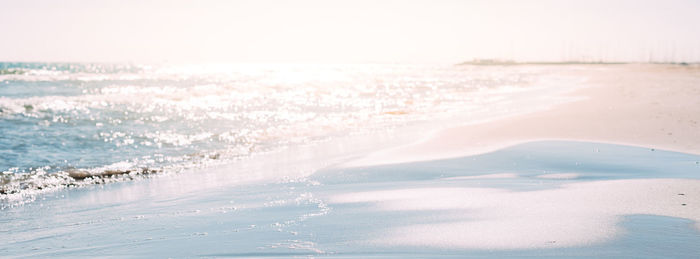 Scenic view of sea against sky during winter