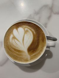 Close-up of cappuccino on table